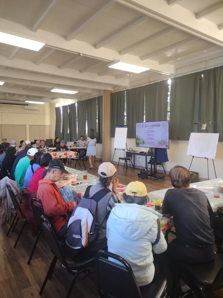 Community members gathered around tables at the Cantonese listening session