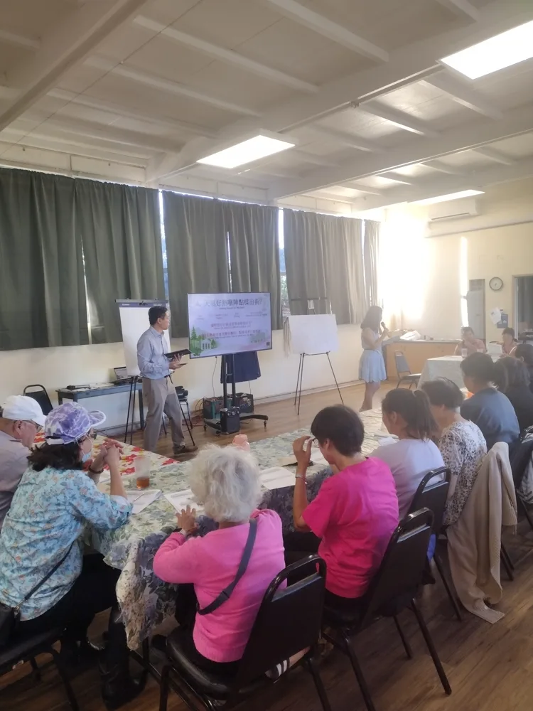 The Cantonese listening session, August 19, 2026. Shared tables and bilingual prompts supported the discussion.